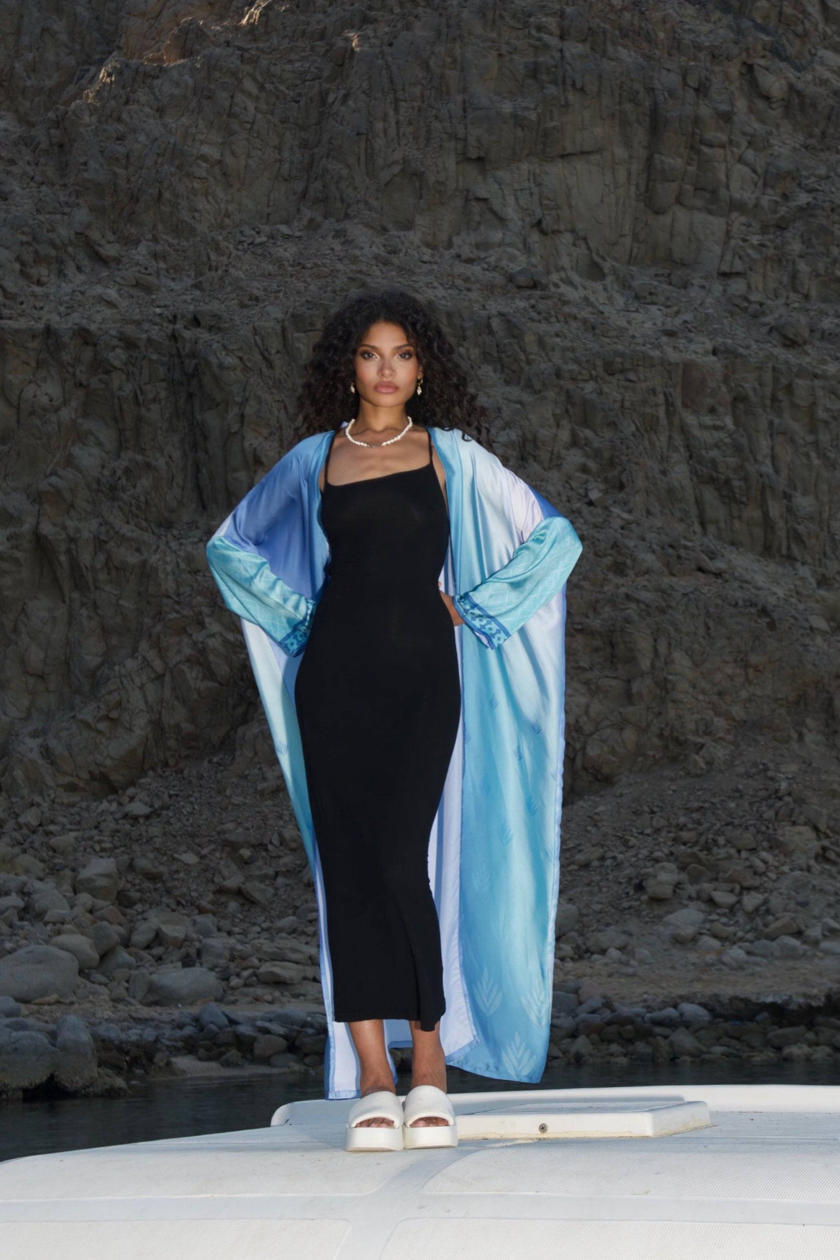Elevate your style with the Indigo Dream Ombré Abaya Set, featuring a flowing blue gradient design over a sleek black dress, perfect for summer chic.