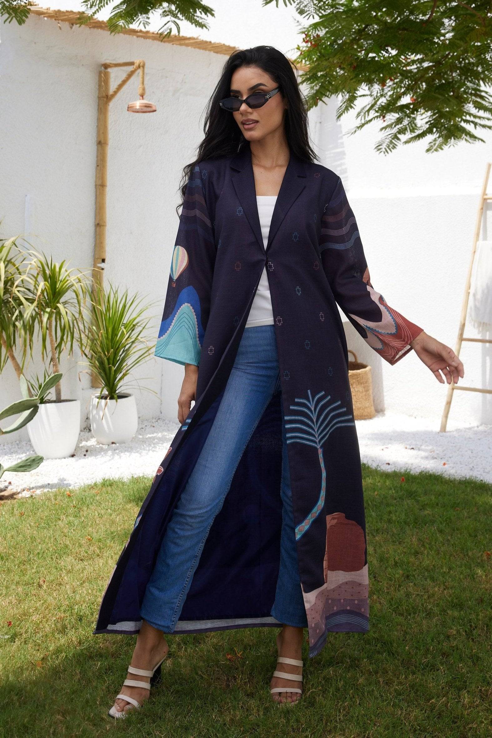Open-front Alula Horizon Blazer Abaya worn over jeans and a white top, blending tradition with casual modern fashion.