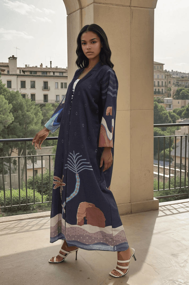 The Alula Horizon Blazer Abaya by The Untitled Project features a navy linen base with colorful Alula-inspired prints, including Elephant Rock.