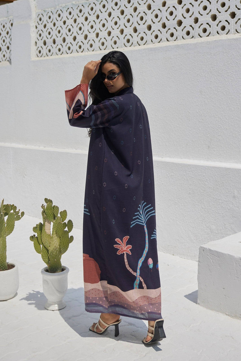 Back view of The Alula Horizon Blazer Abaya showcasing scenic desert artwork and palm trees, crafted in eco-friendly linen fabric.