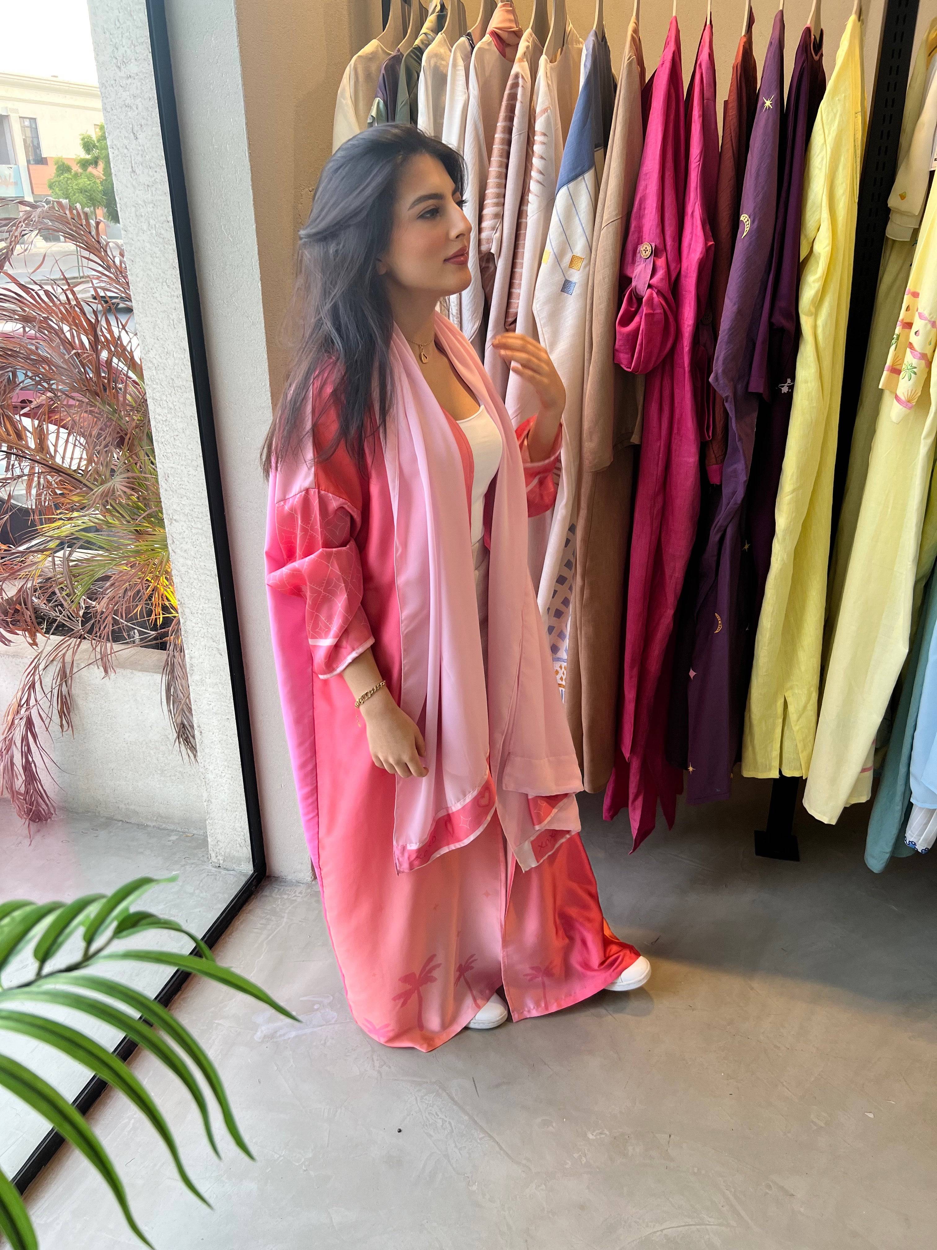 Barbie-Inspired Pink Abaya Set displayed in a boutique, paired with white innerwear for a fresh and elegant look.