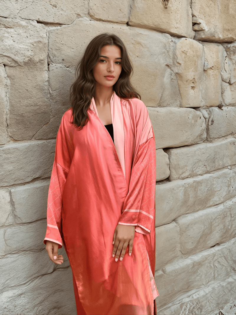 Model wearing the Barbie-Inspired Pink Abaya Set with soft pink scarf, showcasing the luxurious texture and modern cut.
