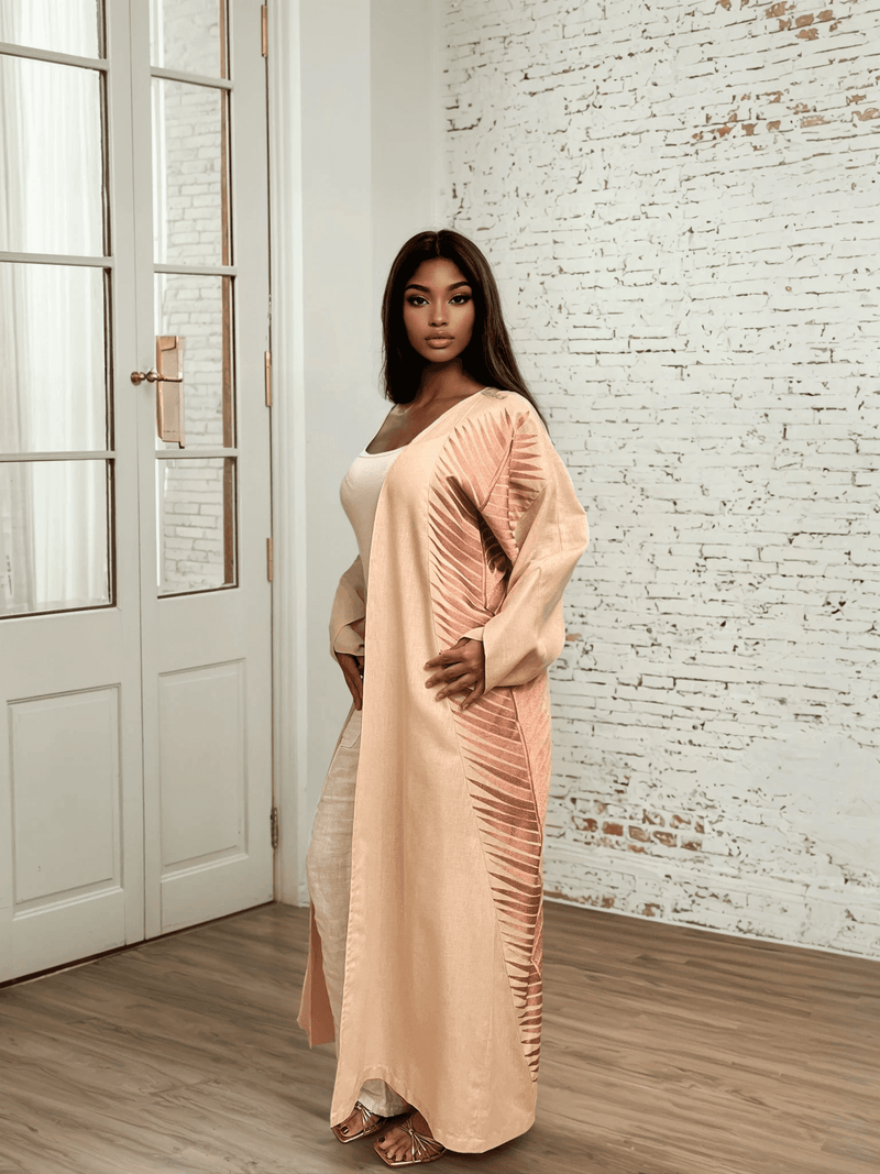Rosé Gold Abaya - Breast Cancer Awareness | Solidarity, Hope. Full-length rose gold abaya with elegant embroidery, blending tradition and advocacy.