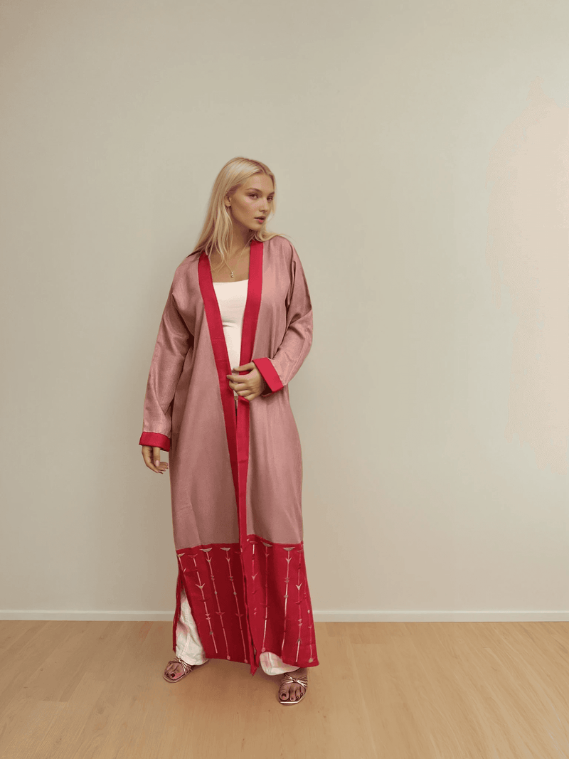 Full-length Cupid's Palette Kimono - Linen Cape featuring bold red hem detailing, perfect for vibrant, wrinkle-free traditional and boho outfits.