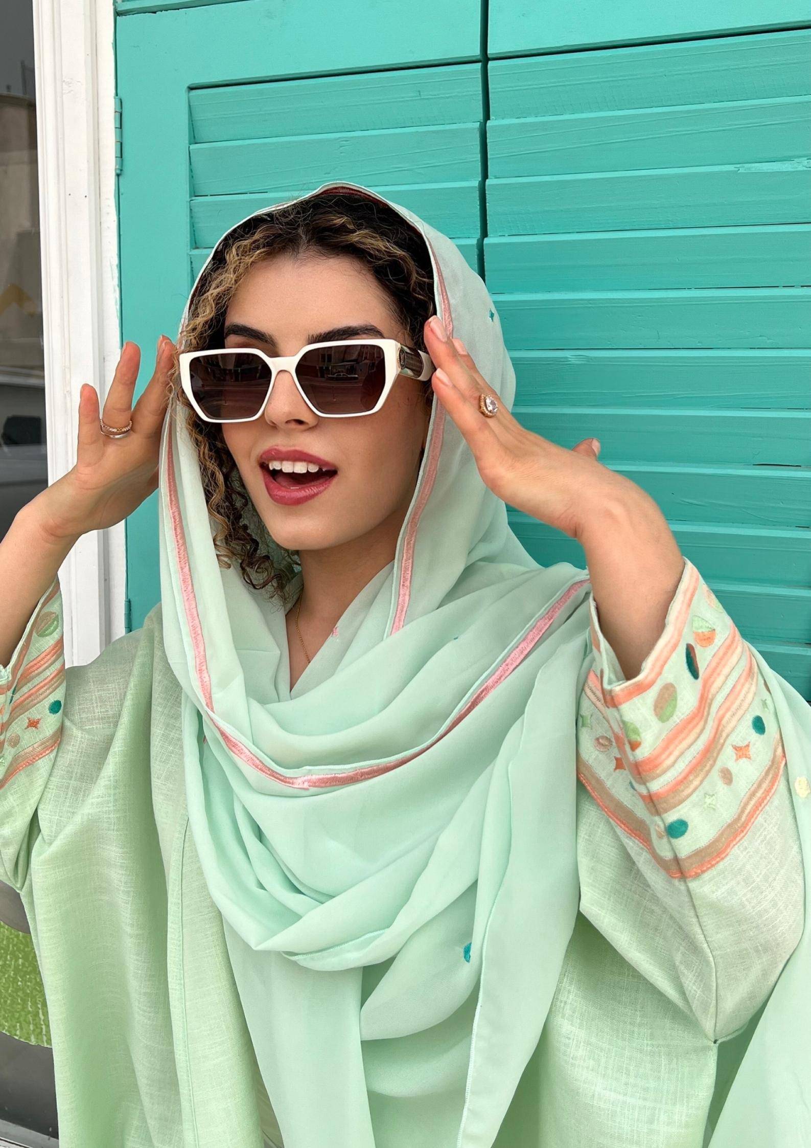 Cold mint Birthday Abaya & Scarf Set styled with sunglasses, showcasing embroidered sleeves and lightweight fabric for summer.