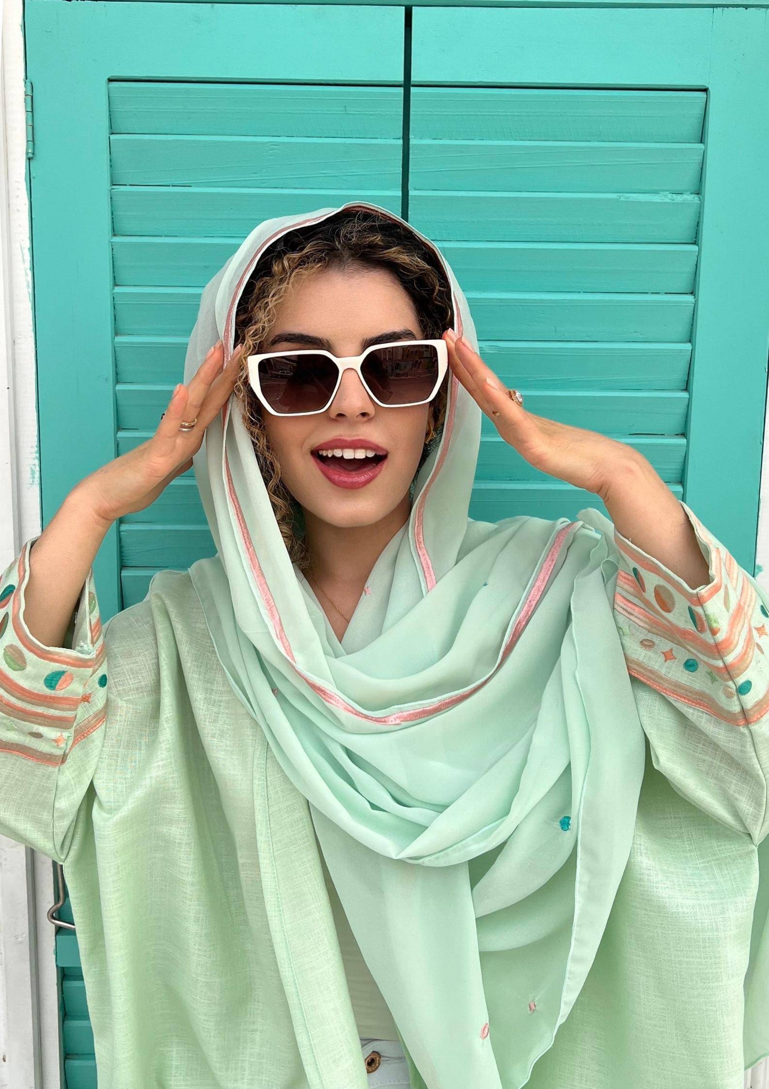 Cold mint Birthday Abaya & Scarf Set with pastel embroidery, styled with white sunglasses for a chic summer look.