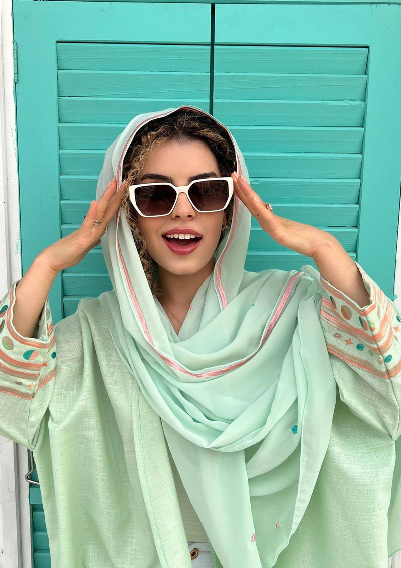 Cold mint Birthday Abaya & Scarf Set with pastel embroidery, styled with white sunglasses for a chic summer look.