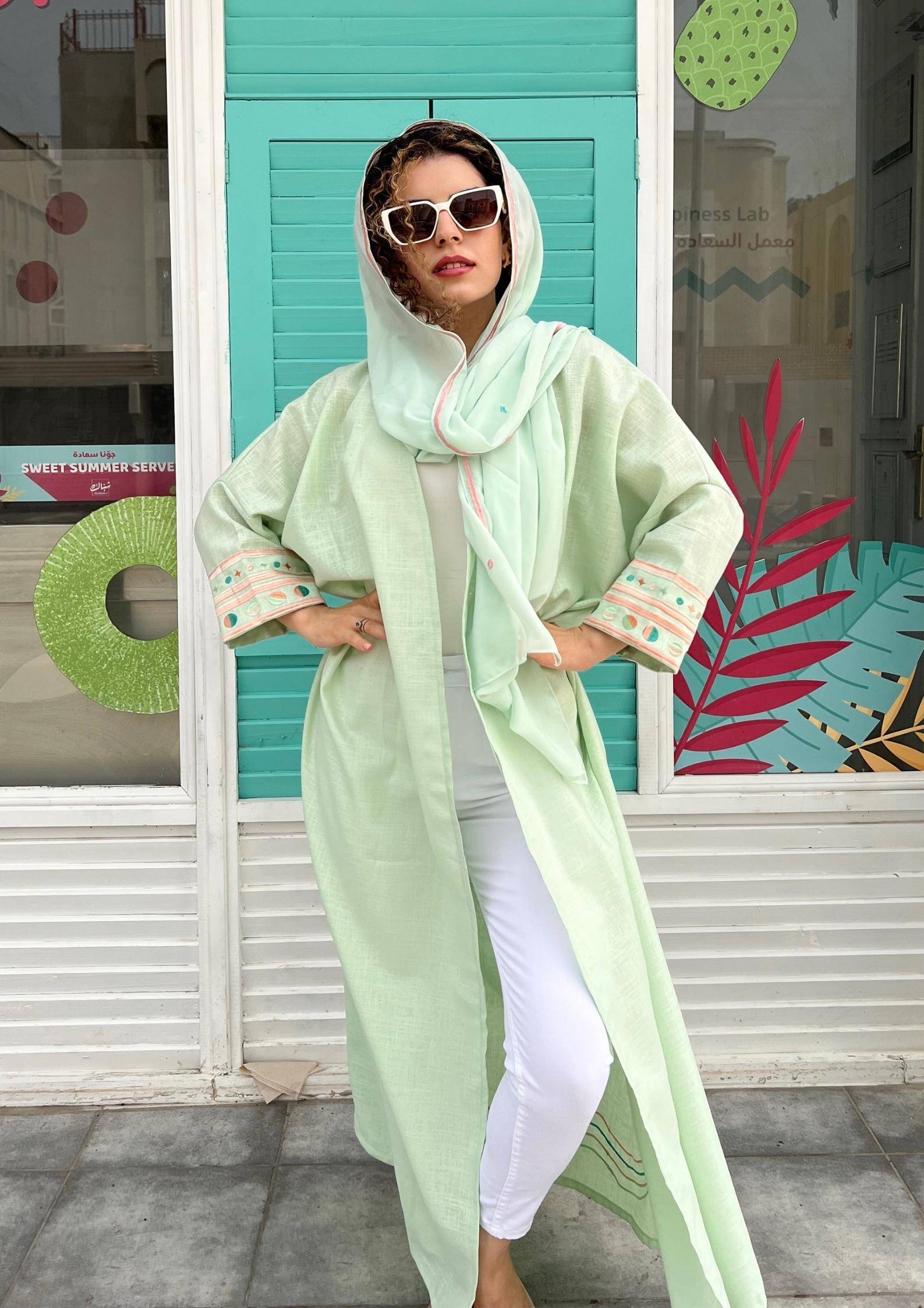 Full view of Birthday Abaya & Scarf Set in cold mint, styled with white outfit and sunglasses for modern traditional fashion.