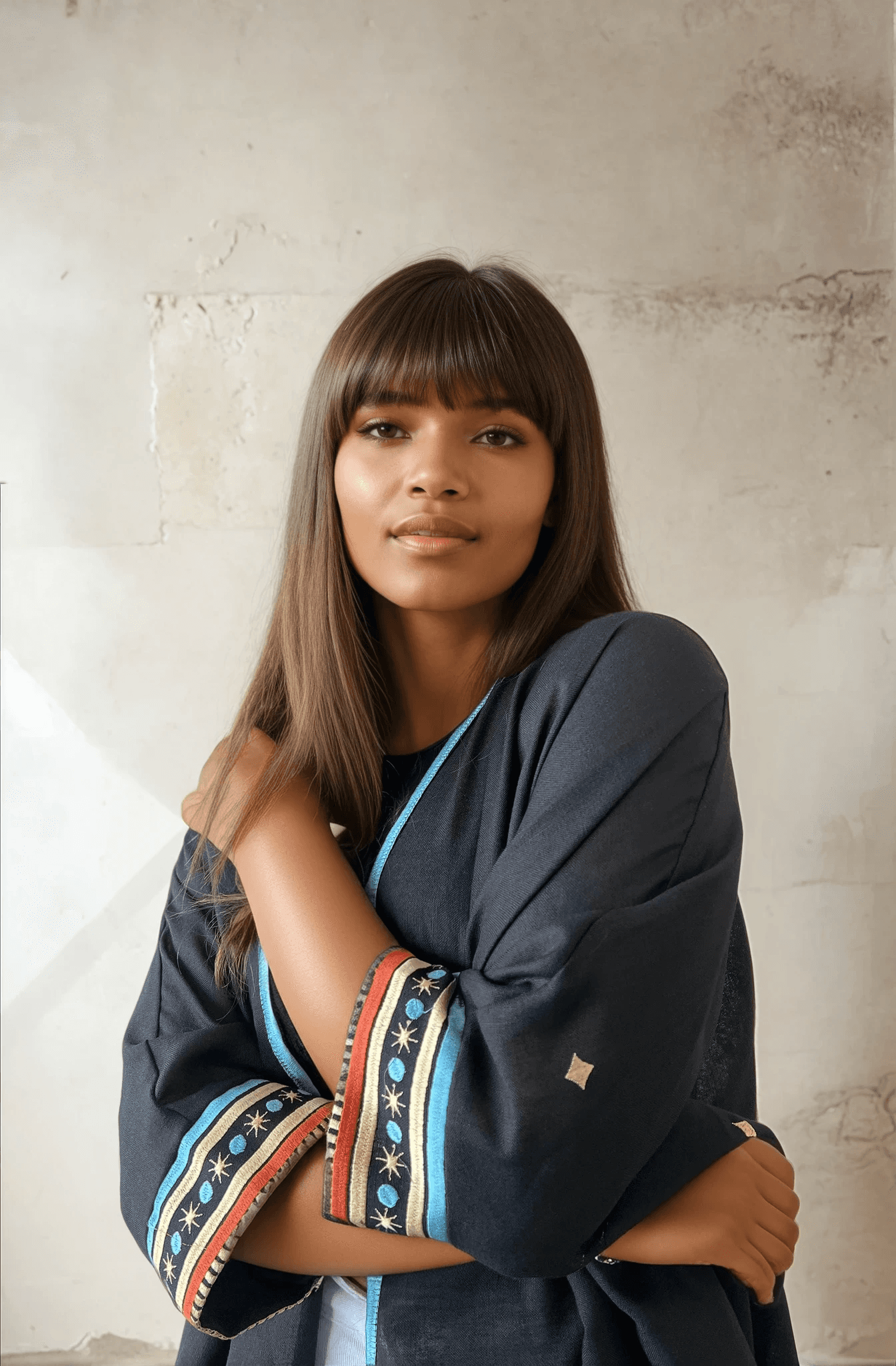 Close-up of Distant Galaxies - Show Stopper Back Abaya highlighting intricate sleeve embroidery with star and planet patterns in vibrant colors.