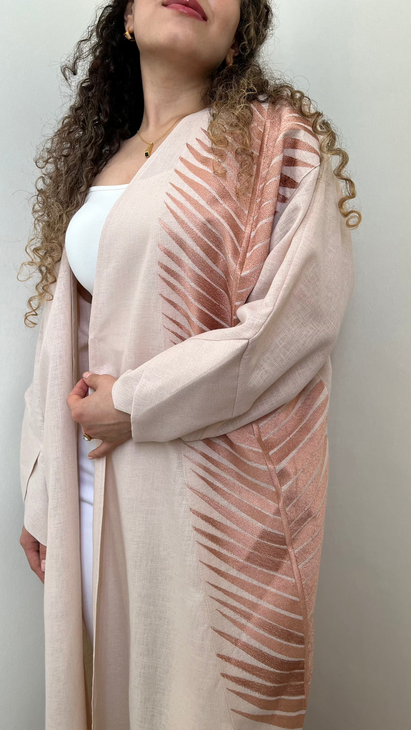 Rosé Gold Abaya - Breast Cancer Awareness | Solidarity, Hope. Front view of abaya with rose gold leaf motif, supporting breast cancer awareness.