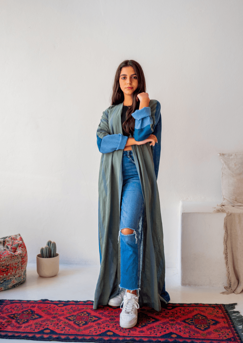 The WORKaholic Abaya - Daily Wear in green and teal, styled with ripped jeans and sneakers for a trendy outfit.