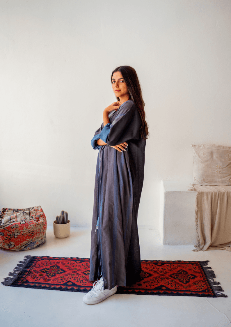 Model wearing The WORKaholic Abaya - Daily Wear in grey, styled with white sneakers for a modern casual look.