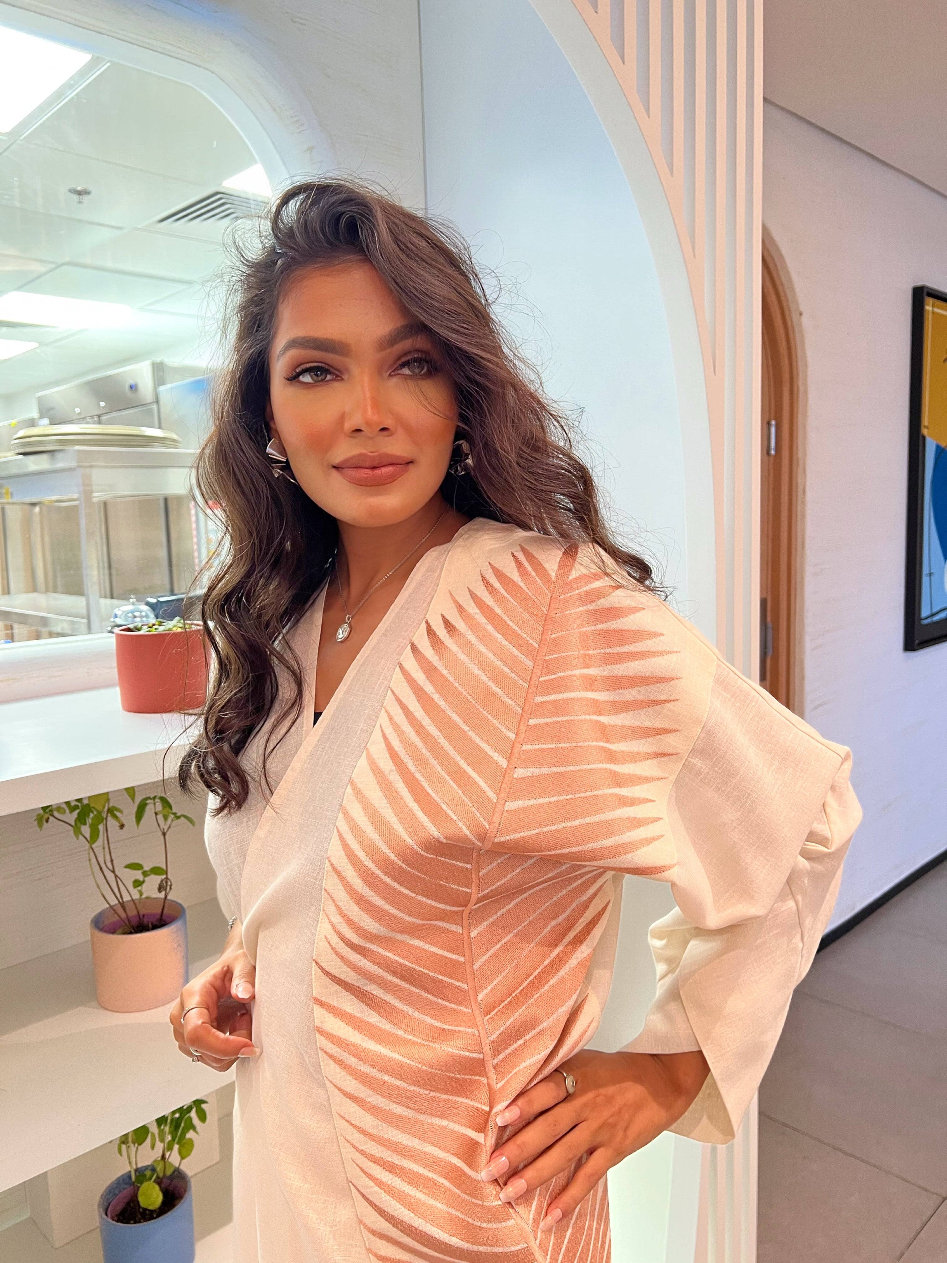 Rosé Gold Abaya - Breast Cancer Awareness | Solidarity, Hope. Elegant abaya with shimmering rose gold accents, ideal for awareness campaigns and events.