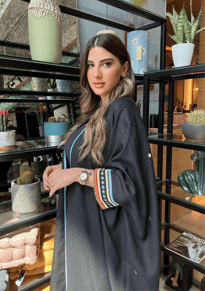 Side view of Distant Galaxies - Show Stopper Back Abaya with detailed sleeve embroidery and soft flowing fabric, ideal for traditional occasions.