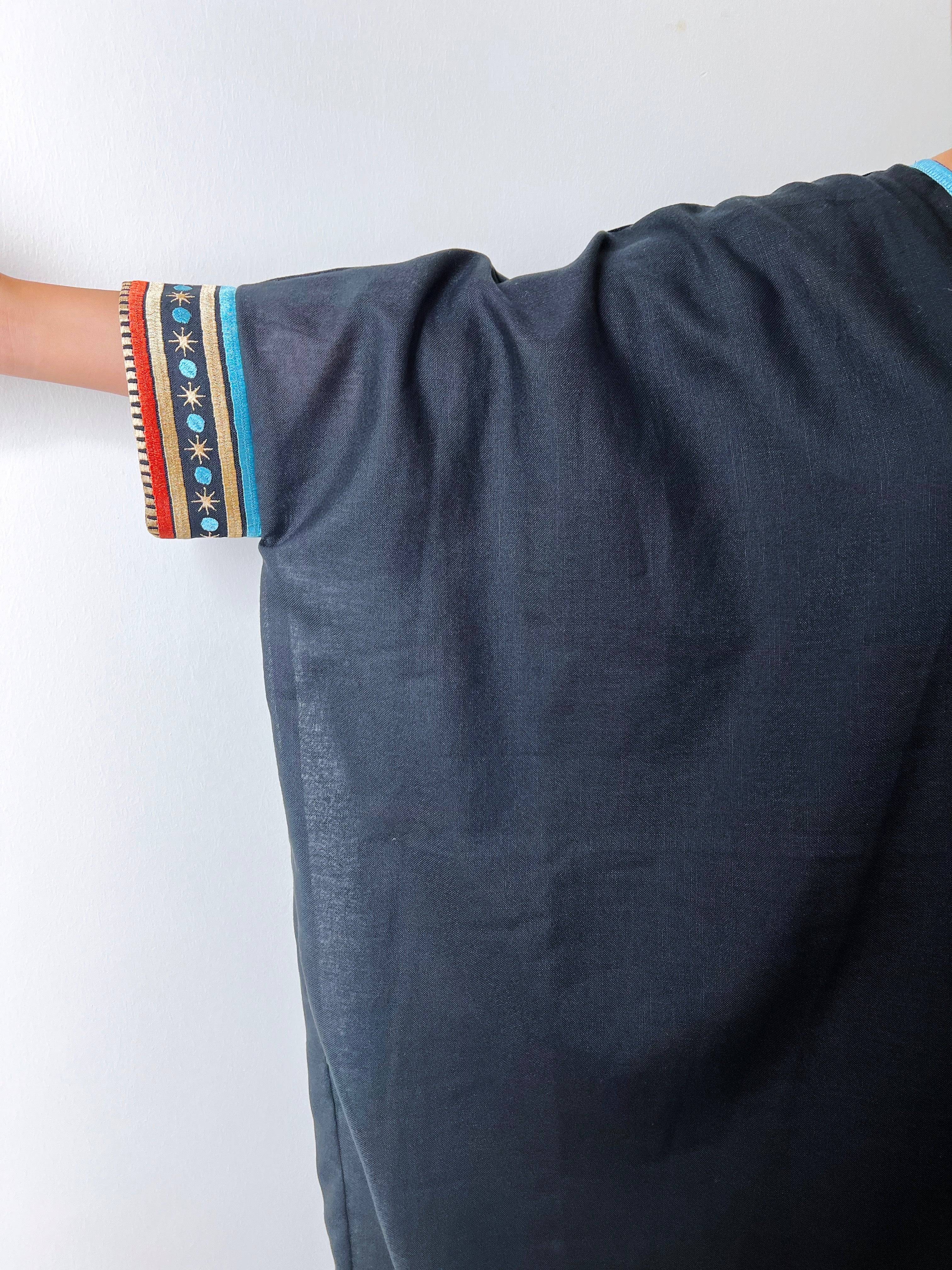 Side arm view of Distant Galaxies - Show Stopper Back Abaya showing wide sleeve cut and embroidered galactic motifs for traditional elegance.