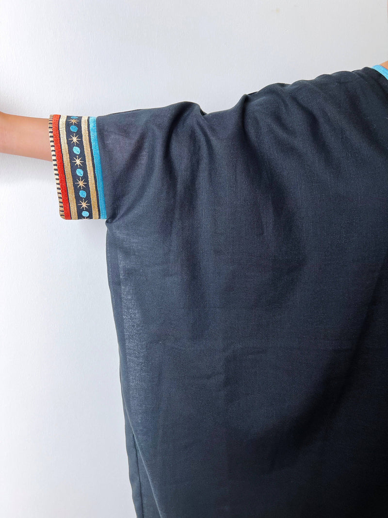 Side arm view of Distant Galaxies - Show Stopper Back Abaya showing wide sleeve cut and embroidered galactic motifs for traditional elegance.