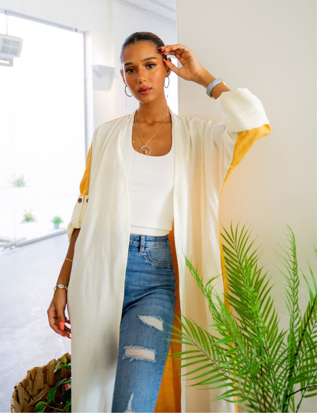 The Vicki Abaya - Daily Wear in mustard and white, styled with denim and layered jewelry for a fashionable everyday ensemble.