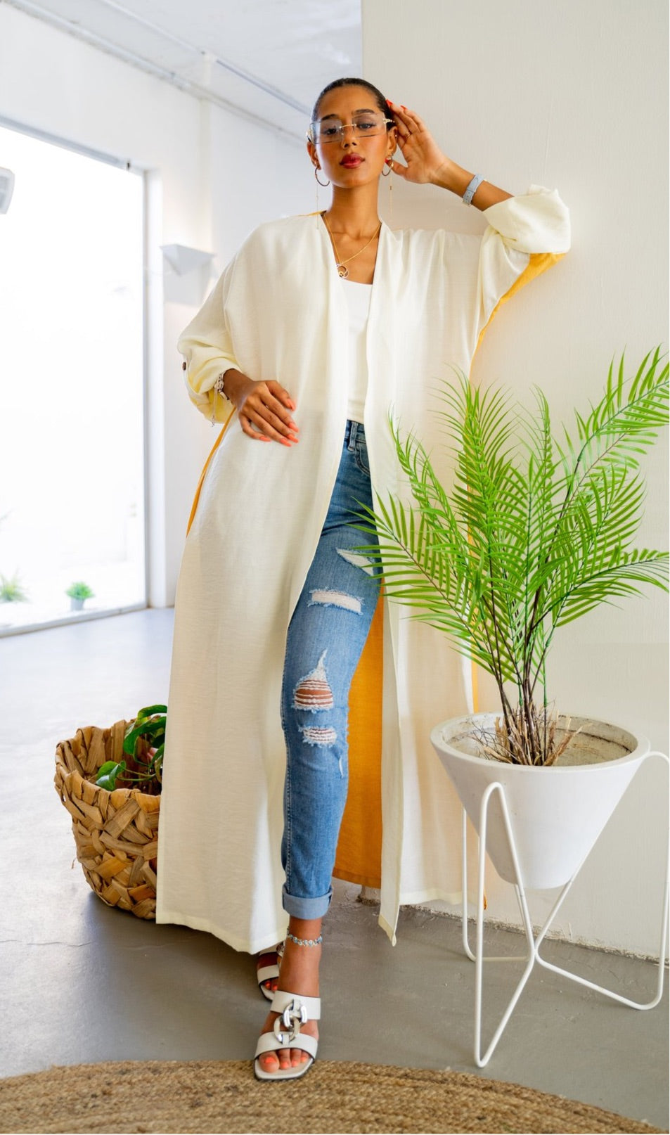 Full-length view of The Vicki Abaya - Daily Wear in mustard and white, styled with ripped jeans and sandals for a breezy daily look.