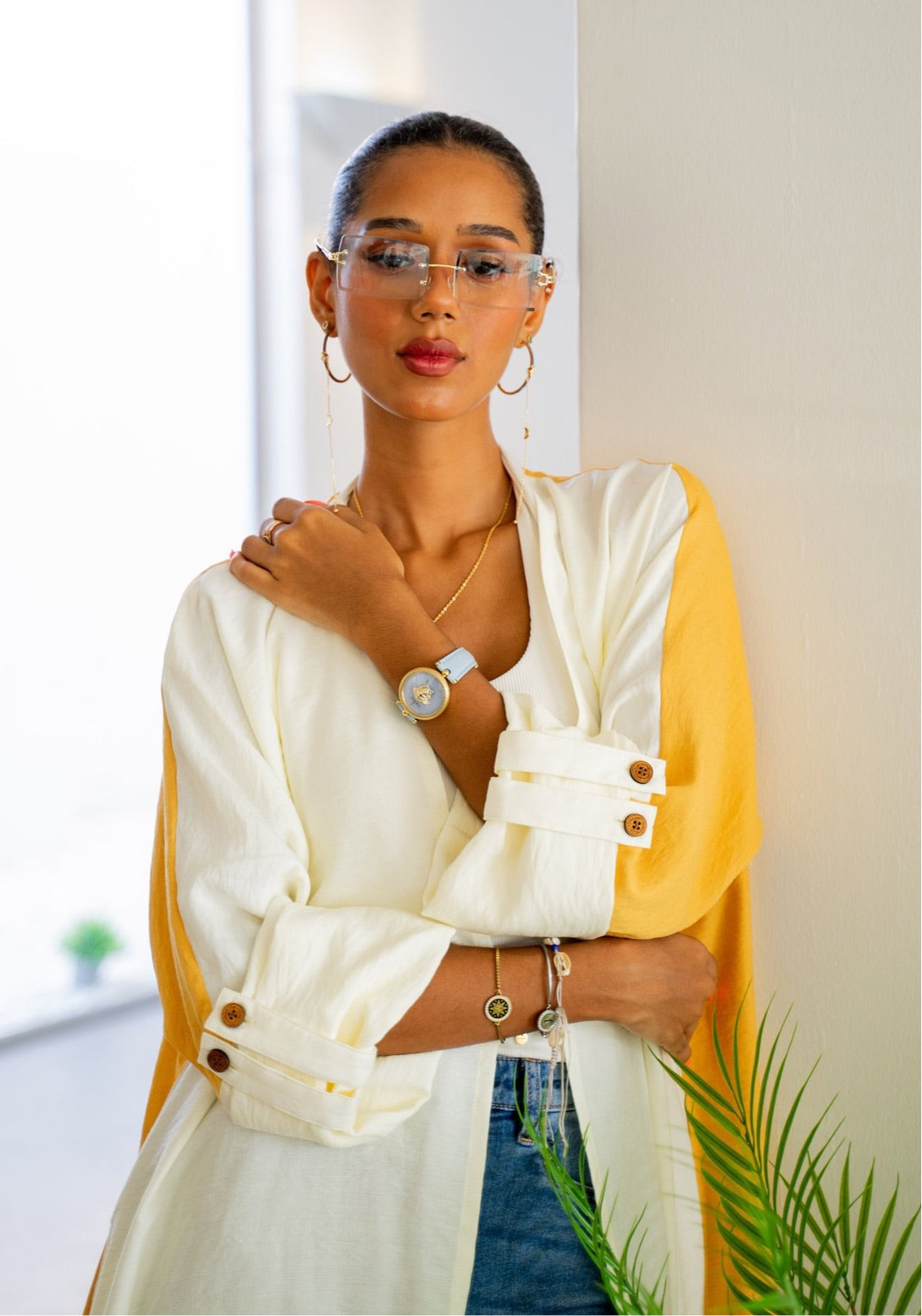 Elegant and casual, The Vicki Abaya - Daily Wear in mustard and white paired with jewelry and denim for a polished daily outfit.