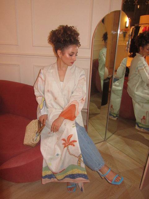 Close-up of The Jeddah Horizon - Abaya & Scarf Set’s front design, highlighting palm tree and abstract desert prints.