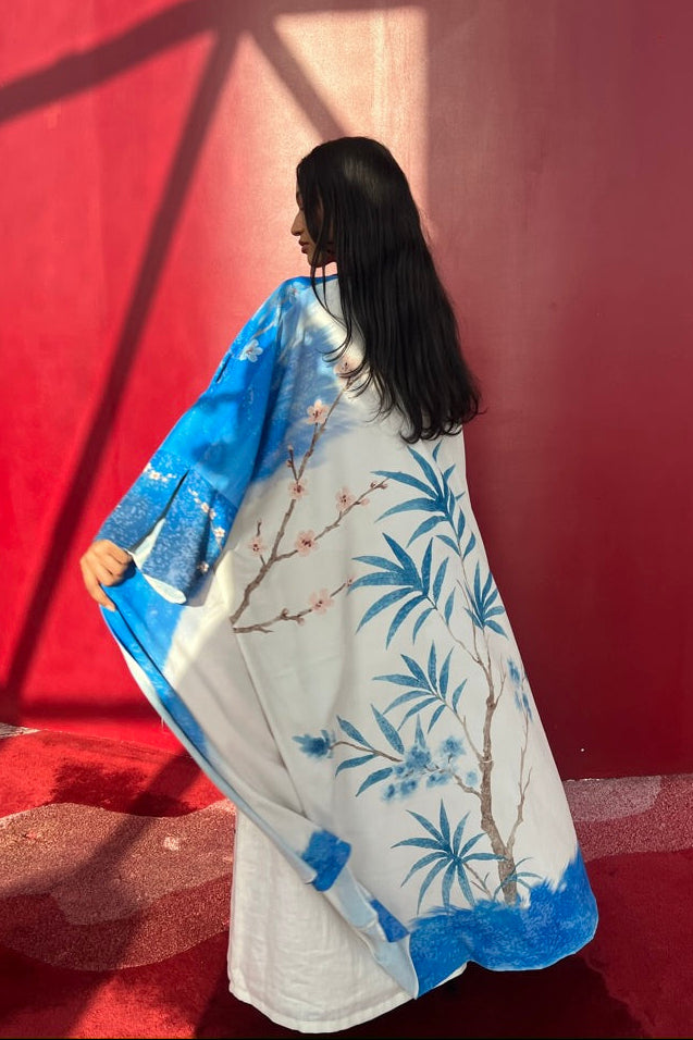 She Thought in Indigo – printed eco-blend matte silk abaya with matching scarf by The Untitled Project, inspired by Saudi coastal landscapes.