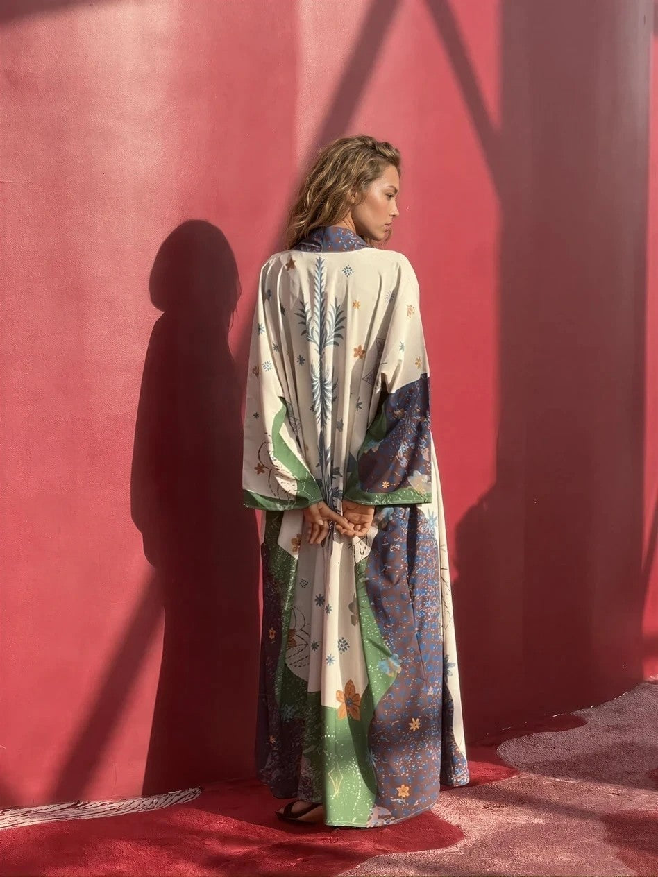 Back view of printed silk abaya with detailed pattern and flow