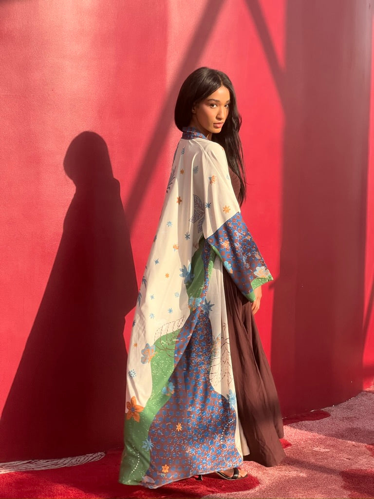 Printed silk abaya and scarf set – The Untitled Project’s Seen Leaving the Corniche, perfect for global resort destinations from Dubai to London.