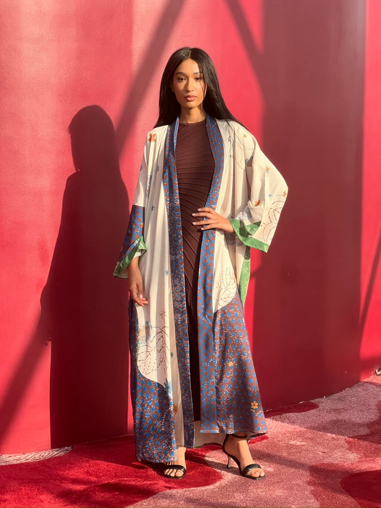 Resortwear abaya with artistic multicolor print – Seen Leaving the Corniche by The Untitled Project, sustainable design available in the UK and US.