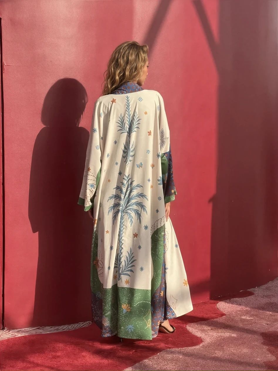 Corniche in Beige from behind, against a red wall