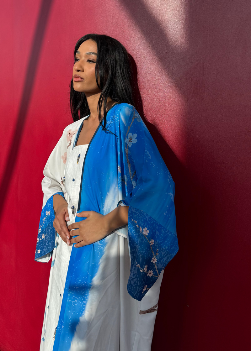 Printed abaya and scarf set in calming indigo and blush — luxury modest resortwear from The Untitled Project Saudi.