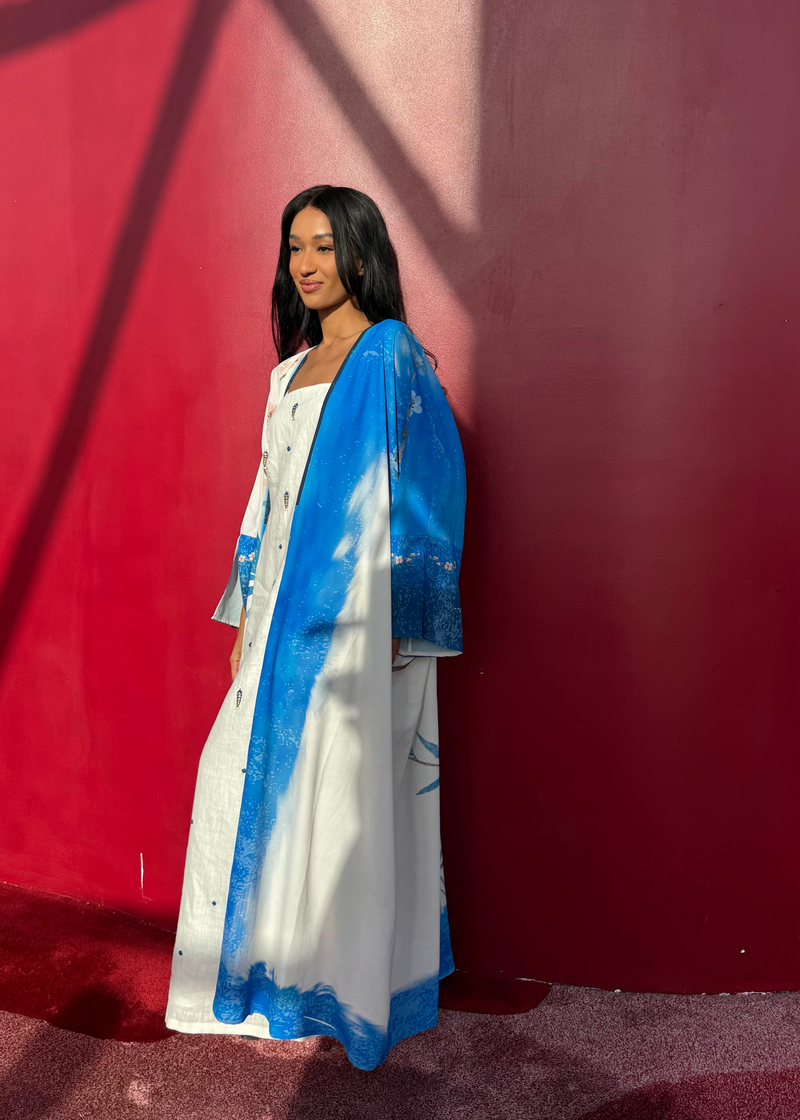 Printed abaya and scarf set in calming indigo and blush — luxury modest resortwear from The Untitled Project Saudi.