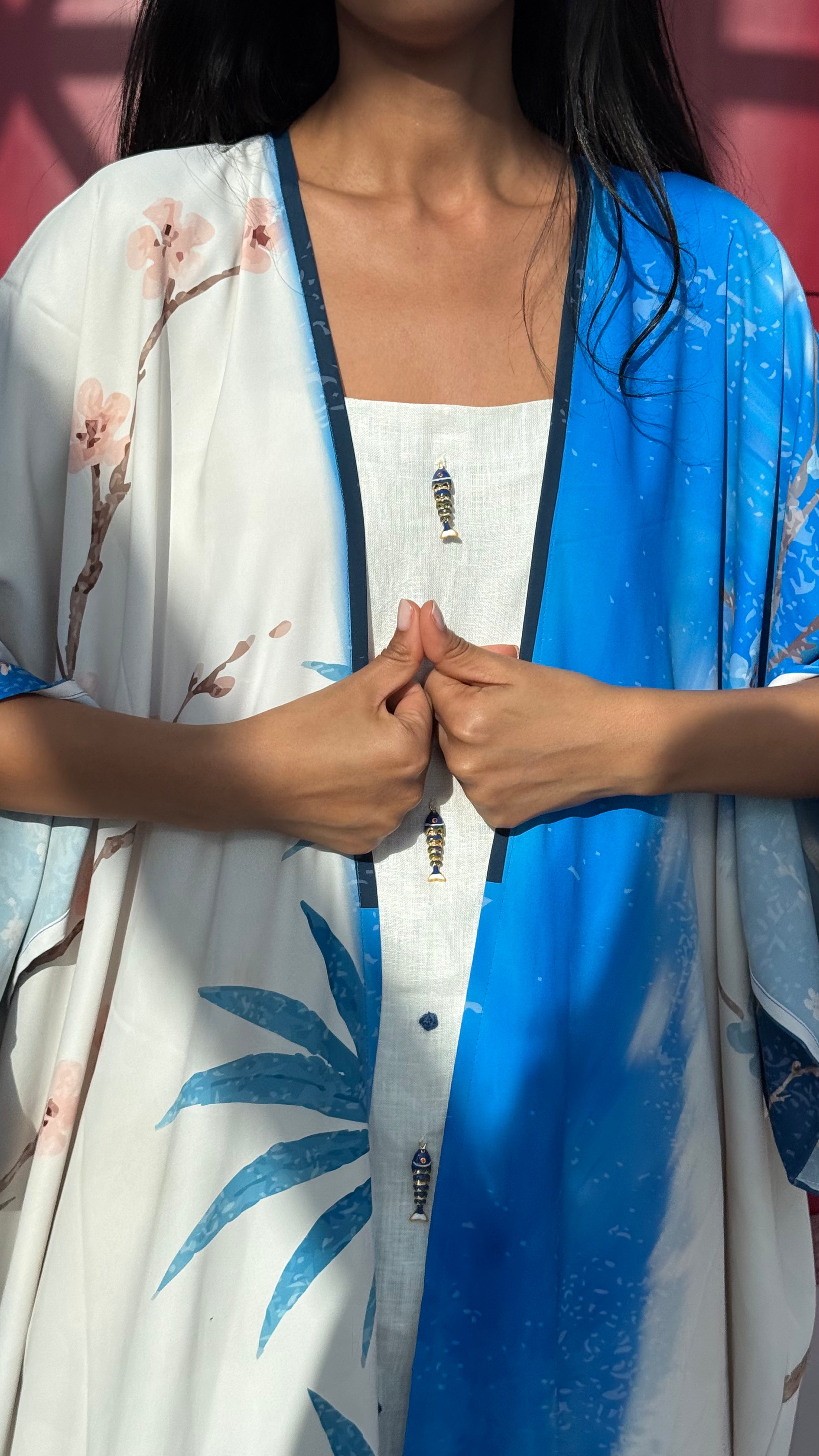 Art-inspired indigo silk abaya with hand-drawn botanical print — resortwear by The Untitled Project, perfect for Dubai or Jeddah summers.