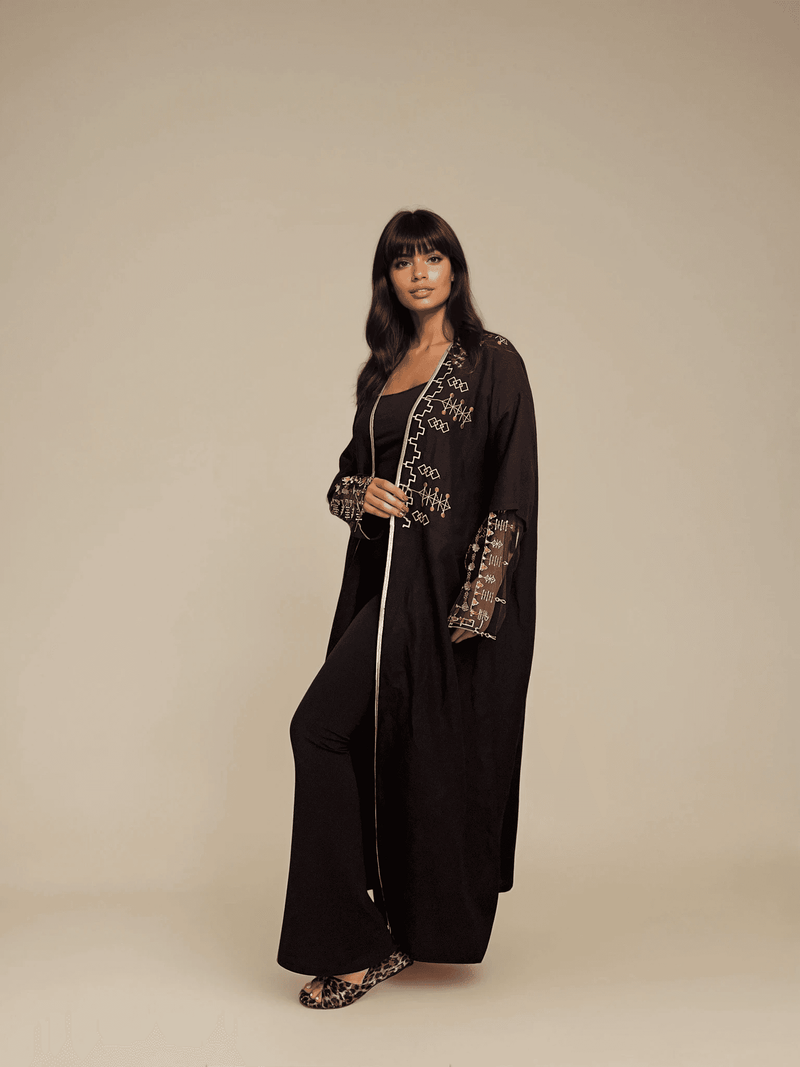 Full-length Saudi Abaya & Scarf Set with detailed embroidery and flowing silhouette, showcasing cultural elegance and modern design.