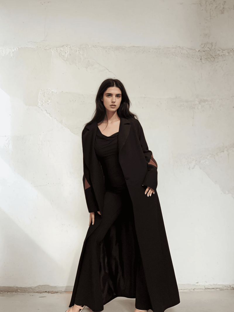 Model wearing The Front Row Feeling - Long Blazer styled with black wide-leg pants, showcasing its full-length and tailored fit.