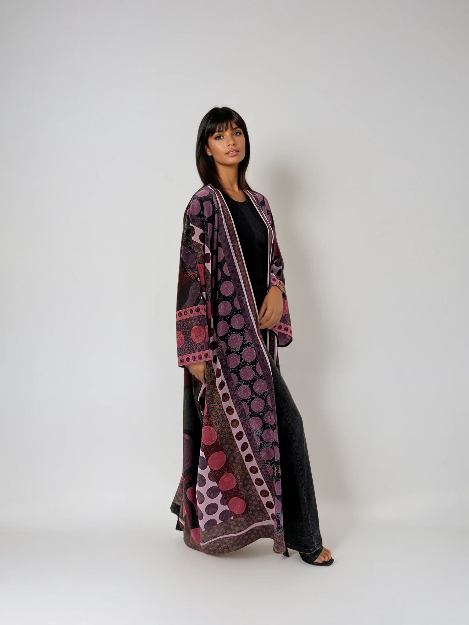 Model wearing The Untitled Project’s A Polka Thought abaya — printed matte silk design with playful purple polka dots.