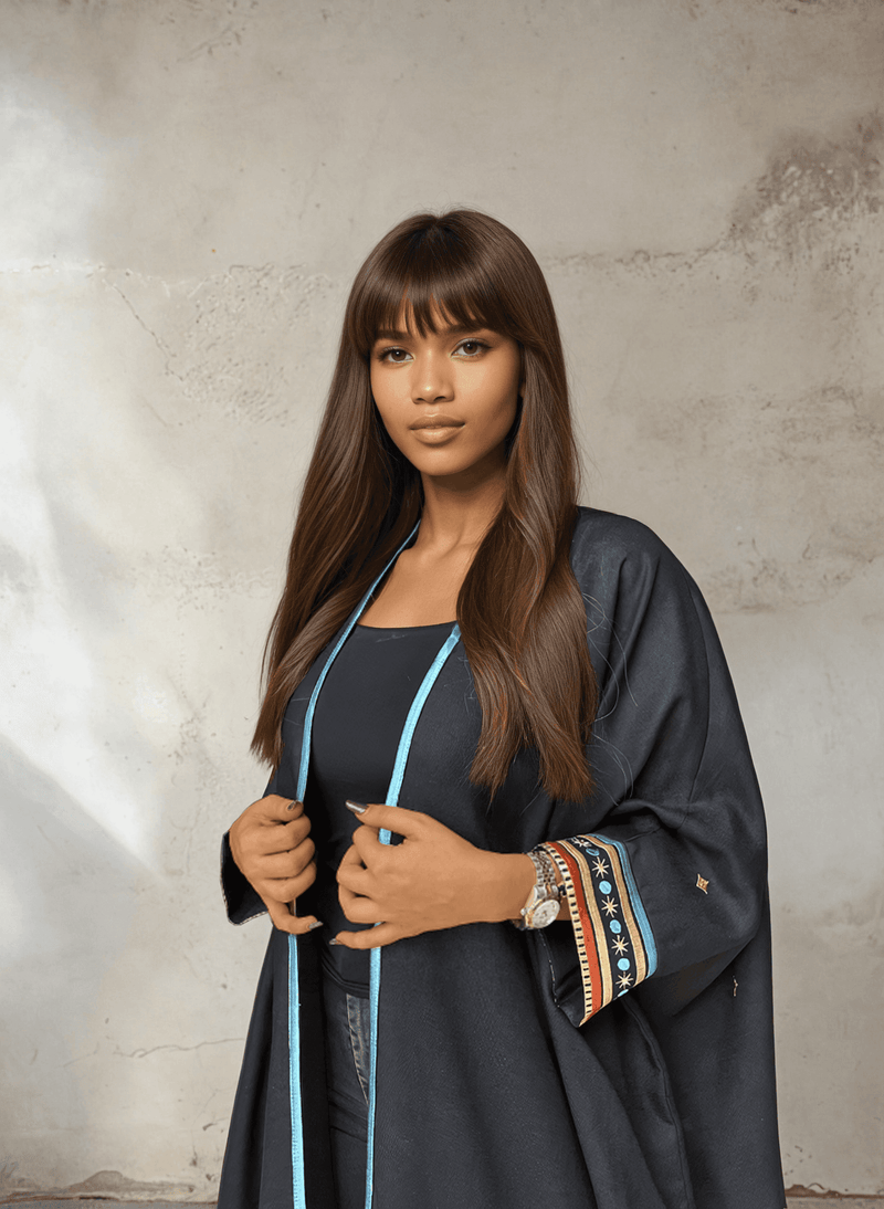 Front view of Distant Galaxies - Show Stopper Back Abaya with blue trim and star-themed sleeve embroidery, styled for modern traditional wear.
