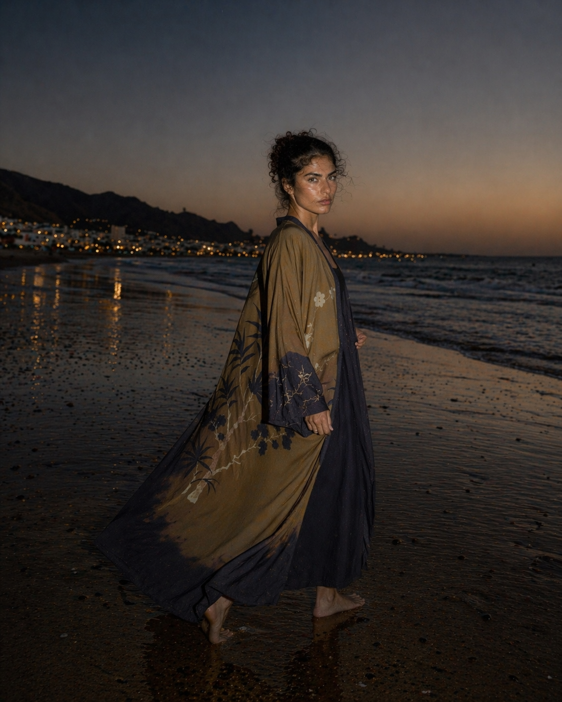 Side profile of a luxury brown and navy satin feel abaya