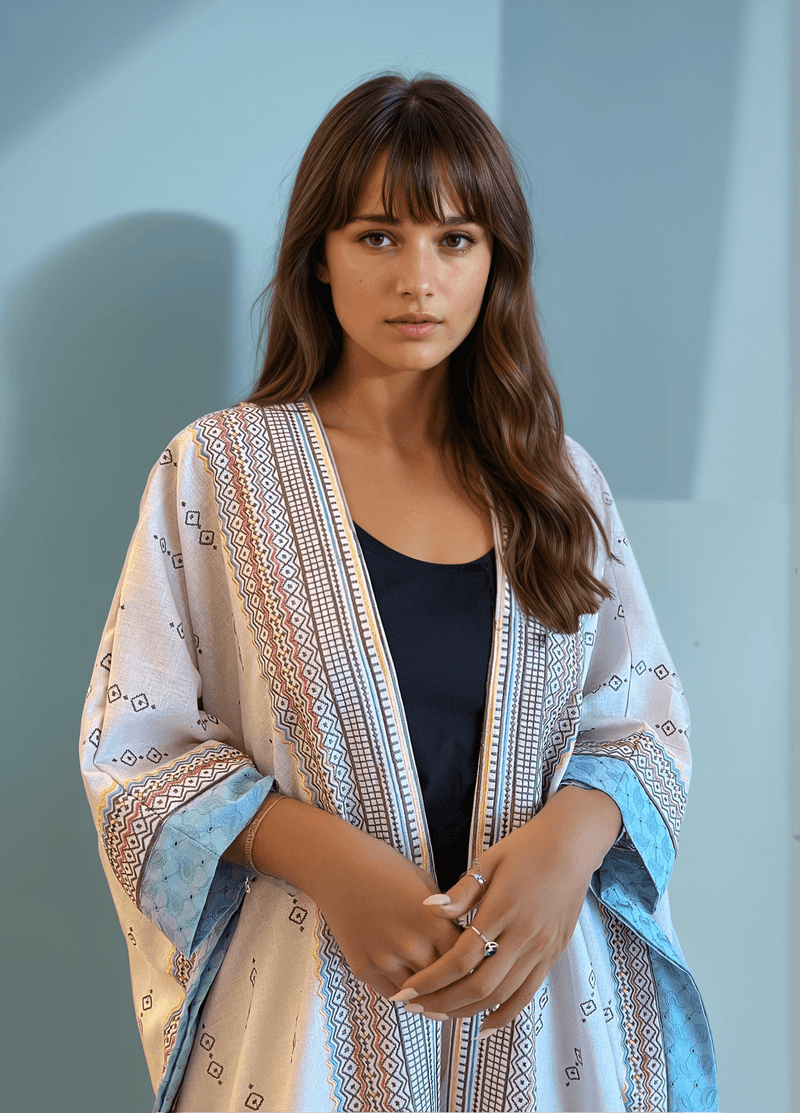 Boho Chic Fatina Abaya with geometric embroidery and blue accents, styled with a black inner top for a modern traditional look.