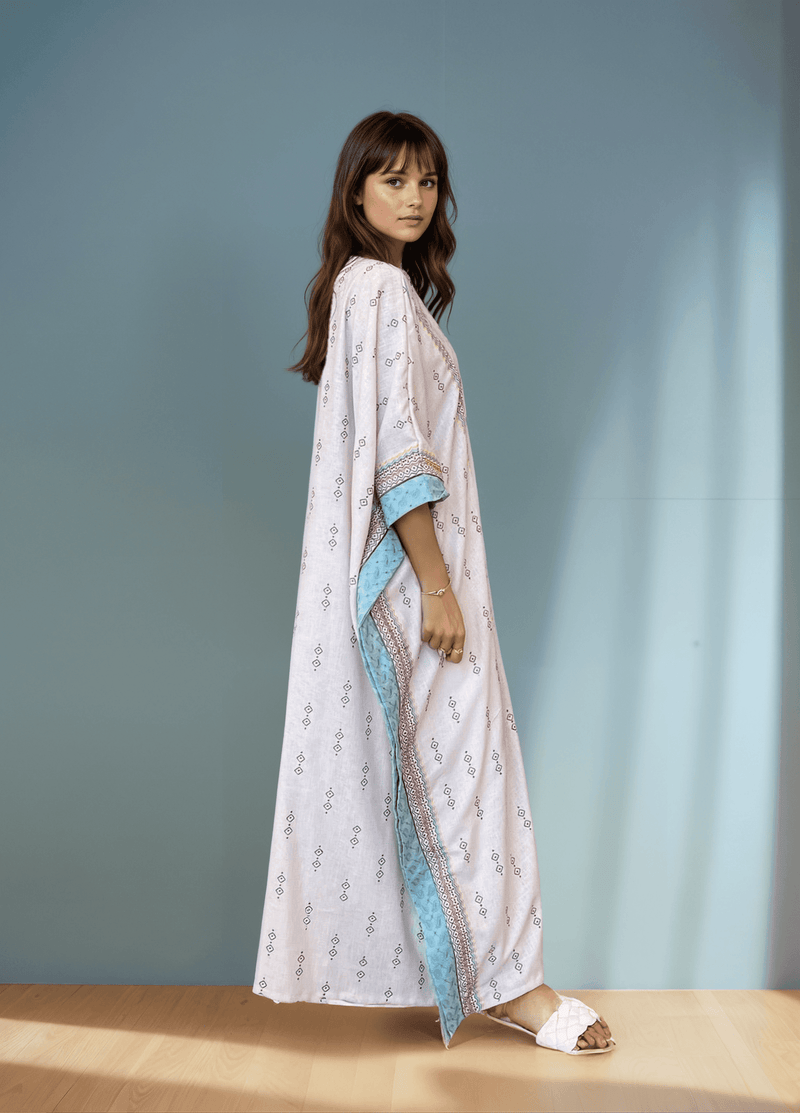 Side view of Fatina Abaya showcasing its flowing silhouette and intricate bohemian embroidery, perfect for ceremonial occasions.