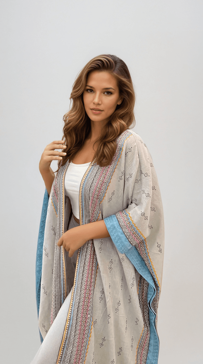 Fatina Abaya & Scarf Set in boho chic style featuring white fabric with blue and multicolor embroidery, ideal for elegant daywear.