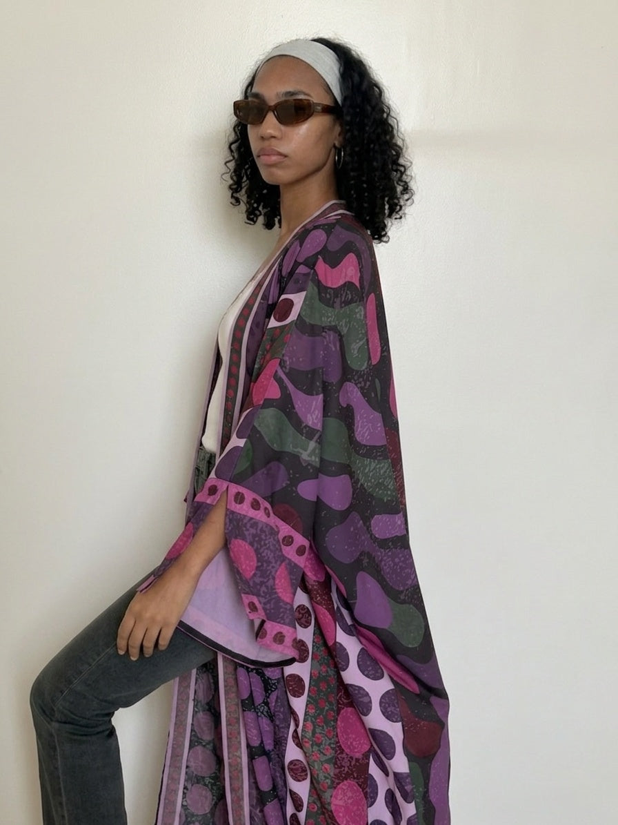 Purple designer abaya with bold printed details and soft drape