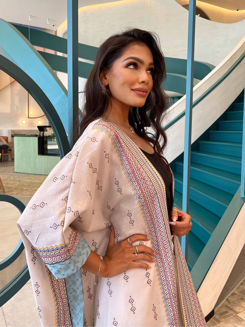 Boho Chic Fatina Abaya with colorful front embroidery and blue sleeve lining, styled for a fashionable traditional look.