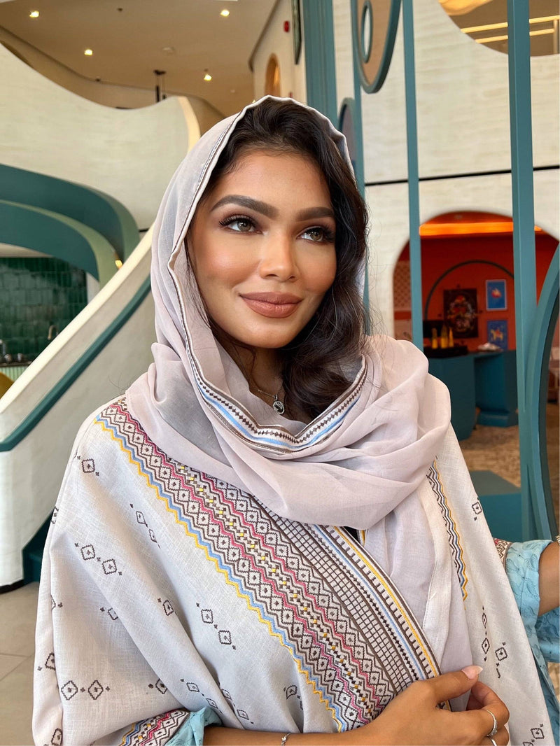 Model wearing Fatina Abaya & Scarf Set with scarf wrapped around head, showcasing the elegant embroidered neckline.